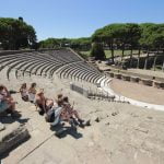 Teens visiting the archeological site of Ostia Antica. Organize your visit with Rome for kids